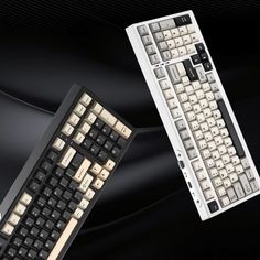 two black and white keyboards are next to each other on a black background, one is turned off