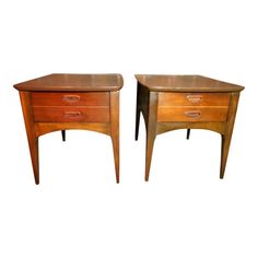 a pair of nightstands with drawers on each side and one drawer at the top