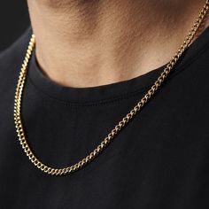 a man wearing a gold chain necklace