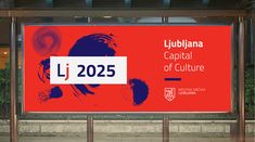 a large red sign with the words lubiana capital of culture on it's side