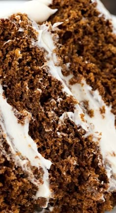 a close up of a piece of cake on a plate with frosting and icing