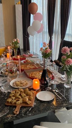 a table is set with food and candles