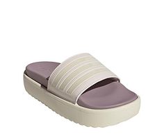 adidas Adilette Platform Womens Slide Sandal Step up your Slide look in the adidas Adilette Platform women s Slide Sandal. With a faux leather upper featuring the 3-Stripes for extra style, this Slide is cool and comfy. The contoured footbed cradles and cushions your foot, while the platform keeps you lifted. Synthetic upper Slip-On Textile liningContoured footbedEVA platform/outsole Adidas Sporty Synthetic Slides, Adidas Synthetic Sport Sandals For Spring, Adidas Sport Sandals For Spring Sports, Synthetic Slides For Sports In Spring, Adidas Sandals With Logo, Synthetic Material, Adidas Synthetic Sport Sandals, Adidas Sporty Sport Sandals For Spring, Sporty Adidas Sandals In Synthetic Material, Sporty Adidas Sandals With Synthetic Material