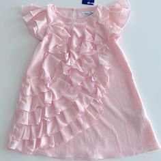 Special Day Ruffles Dress New With Tags Color: Pink Size: 6 Years Old Pink Ruffle Twirl Dress For Spring, Pink Ruffled Twirl Dress For Spring, Pink Ruffle Dress For Spring Dress-up, Pink Ruffle Dress For Dress-up Occasions, Pink Ruffle Dress For Dress-up, Pink Ruffle Dress For Spring Formal Occasions, Pink Ruffled Dress With Short Sleeves, Pink Short Sleeve Dress With Ruffles, Sweet Party Dress With Ruffle Hem