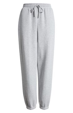 Work out or chill out in these comfy cotton-blend joggers designed with an easy tie waist. 29" inseam; 12" leg opening; 12 1/2" front rise; 16" back rise (size Medium) Elastic/drawstring waist 68% cotton, 32% recycled polyester Machine wash, tumble dry Imported Not available for sale and shipment to Germany Fall Cotton Joggers For Loungewear, Spring Cotton Joggers For Loungewear, Trendy Cotton Sweatpants With Elastic Waistband, Trendy Cotton Joggers For Lounging, Spring Cotton Joggers With Ribbed Waistband, Gray Sweatpants For Spring Loungewear, Trendy Cotton Joggers With Elastic Cuffs, Trendy Cotton Sweatpants For Loungewear, Cotton Sweats With Elastic Waistband For Spring