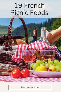 a picnic table with wine, fruit and bread in front of the words 19 french picnic foods