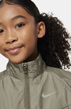 Breathable mesh and lightweight construction mean a comfortable fit in this kid-size jacket that'll keep young athletes warm on and off the playground. Front zip closure Stand collar Elastic cuffs Elastic waist Front welt pockets Lined 58% cotton, 40% polyester, 2% spandex with durable water-repellent (DWR) finish Machine wash, line dry Imported Nike Functional Track Jacket For Light Sports, Nike Track Jacket For Light Sports In Fall, Nike Nylon Windbreaker With Moisture-wicking, Nike Moisture-wicking Nylon Outerwear, Nike Moisture-wicking Outerwear For Outdoor Activities, Nike Nylon Long Sleeve Activewear, Nike Long Sleeve Nylon Activewear, Casual Nylon Breathable Track Jacket, Casual Breathable Nylon Track Jacket