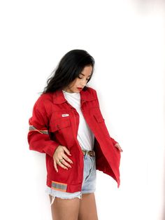 80s/ early 90s vintage red utility jacket with fluorescent patches. Four large pockets. Sturdy fabric.  Front zipper along with snap closures at the top and bottom. ESTIMATED ERA: 1980s, perhaps early 1990s. BRAND: egro design FABRIC: 65% polyester, 35% cotton. CONDITION: 9/10 Minor flaws include: - a very slight in color INDICATED SIZE: GB 54 RECOMMENDED SIZES FOR WOMEN: M to L MEN: S to M  *please refer to pictures and measurements below.* MEASUREMENTS (GARMENT LAID OUT FLAT) shoulders (sleeve Red Utility Jacket Outfit, Casual Red Outerwear With Patch Pockets, 90s Style Red Long Sleeve Windbreaker, Vintage Red Track Jacket For Winter, Red Retro Outerwear With Pockets, Retro Red Outerwear With Pockets, Oversized Red Outerwear With Pockets, Red Oversized Outerwear With Pockets, 90s Red Long Sleeve Windbreaker