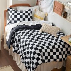 a black and white checkered comforter on a bed