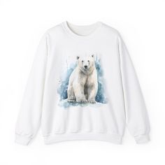 For the colder weather, for the winter nights, keep warm and cozy with a nice watercolor Polar Bear sweatshirt - only in white to really match that artic aura - Perfect for those who can't stay warm, love bears, love animals, or just love a nice sweatshirt! Ideal for any situation, a unisex heavy blend crewneck sweatshirt is pure comfort. These garments are made from polyester and cotton. The collar is ribbed knit, so it retains its shape even after washing. There are no itchy side seams on these sweaters.  .: Made with a medium-heavy fabric blend of 50% cotton and 50% polyester (8.0 oz/yd² (271.25 g/m this sweatshirt feels cozy and is the perfect choice for those colder months. .: The classic fit along with the crew neckline deliver a comfy wearing experience with a clean-cut style. Meanw White Graphic Print Sweater For Winter, White Top With Graphic Print And Cozy Fit, Winter Bear Print Cotton Top, Winter Cotton Top With Bear Print, White Winter Sweatshirt With Graphic Print, White Graphic Print Sweatshirt For Winter, Cozy White Tops With Graphic Print, Cozy White Top With Graphic Print, White Relaxed Fit Sweatshirt For Winter