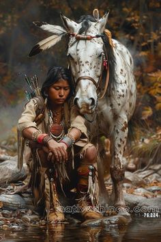 a native american woman sitting next to a white horse