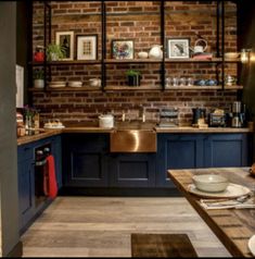 the kitchen is clean and ready to be used for dinner or lunchtime, with brick walls