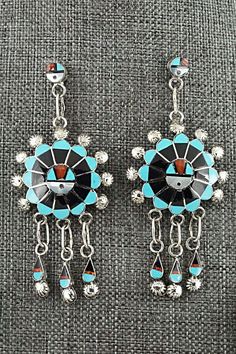 This Zuni Sunface set featuring turquoise, onyx, mother of pearl, coral, opalite and sterling silver inlay necklace, earrings, ring and bracelet was made by Zuni silversmith Abel Soseeah. The set is signed.Necklace: 18"Pendant Length: 2 5/8"Pendant Width: 1 3/4"Earrings:Length: 2 3/4"Width: 1 1/4"Bracelet:Size: 5 5/8" (will fit up to a 6 5/8" wrist)Gap: 1"Width: 1 5/8"Ring:Size 7.5Width: 1 1/4Length: 1 1/4Free shipping on all orders! We ship with USPS and always include tracking. All orders ship Sterling Silver Turquoise Inlay Jewelry, Turquoise Inlay Sterling Silver Jewelry, Sterling Silver Artisan Jewelry With Inlay, Artisan Sterling Silver Jewelry With Inlay, Artisan Sterling Silver Inlay Jewelry, Southwestern Silver Jewelry With Inlay, Artisan Jewelry With Matching Earrings For Collectors, Artisan Collectible Jewelry With Matching Earrings, Southwestern Jewelry With Inlay For Gifts