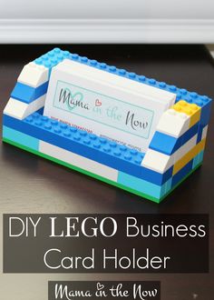 a lego business card holder on a table with the words diy lego business card holder