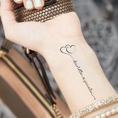 a woman's arm with a tattoo on it that says, i love you