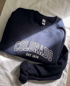 Experience Colorado charm in our embroidered sweater. Stay cozy with this stylish essential, perfect for any occasion. Elevate your wardrobe with a touch of local flair! Embroidered Sweater, Sister Love, Stay Cozy, Mens Clothing, Sweat Shirt, Colorado, Gender Neutral, Bathing Beauties, Adult Outfits