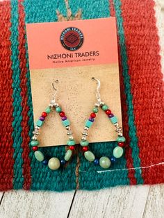 New without tags* ETHNIC REGIONAL STYLE : Native American * METAL : Sterling Silver * MAIN STONE : Multi Stone * BRAND : Nizhoni Traders LLC * JEWELRY TYPE : Earrings * TYPE : Beads * STYLE : Hoop * FEATURED REFINEMENTS : Navajo Earrings * TRIBAL AFFILIATION : Navajo Navajo Sterling Silver Multi Stone beaded dangle hoop earrings. Such a great pair for any collection! These beauties measure 2 1/2 inches long and 1 1/8 inches wide. Stones are natural and may vary.            Thank you for checking out our items. Please contact us if you have any questions.           4/22/24    Exported By ExportYourStore :) SKU:448027494647_991A* Southwestern Dangle Hoop Earrings With Ear Wire, Adjustable Teardrop Artisan Hoop Earrings, Adjustable Artisan Teardrop Hoop Earrings, Multicolor Teardrop Hoop Earrings Bohemian Style, Southwestern Style Dangle Hoop Earrings As Gift, Southwestern Dangle Hoop Earrings As Gift, Artisan Teardrop Hoop Earrings, Multicolor Southwestern Teardrop Jewelry, Multicolor Teardrop Hoop Earrings With Dangling Beads