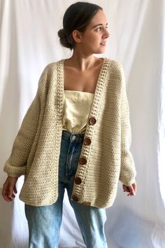 This Beige Oversized cardigan, has a gorgeous V neckline and is 100% handmade. This wool cardigan has a beautiful clousure with gorgeous dark wooden buttons. This hand crocheted jacket is made with hight quality yarn, antiallergic and super super soft. This amazing oversize cardigan is the gargment that you would want wear it forever! Perfect to wear it with dresses or with a jean! Super comfy, stylish and versatile! WHICH IS MY SIZE? This cardigan is One size fits all (S-L).  If you are not sure if it fits you, here you have the measurements of the back and the lenght. The width from shoulder to shoulder is 55 cm/21,6 in and length 75 cm/29,5 in.  If you can't find your size or you are not sure about the size, contact me and I will make the one that fits your measurements. HOW TO KEEP YOU Beige Chunky Knit Cotton Cardigan, Casual Beige Crochet Outerwear, Beige Crochet Knit Cardigan, Oversized Knitted Beige Outerwear, Cozy Cream Crochet Sweater, Beige Crochet Knit Outerwear, Beige Crochet Sweater For Fall, Casual Cream Crochet Cardigan, Casual Hand Knitted Beige Outerwear