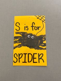 a piece of paper with the words s is for spider on it