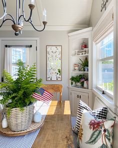 a dining room table with plants in baskets on it