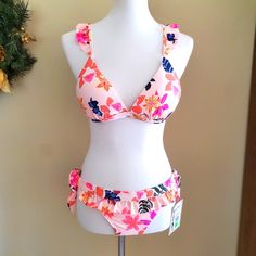 Nwt! 2pc Cute Floral Bikini. Bikini Top Is Large, And Bottoms Are Medium. Swim Top Criss Crosses In The Back For A Cute Look. Swim Bottoms Have Ruffled Edges To Match Swim Top Straps. Swim Bottoms Are Nwt. Swim Top Is Also New, However, Tags Were Taken Off Too Soon. 2pc Is Sold As A Set. If Only One Piece Of The Bikini Set Is Wanted, Please Message Me. Fitted Pink Tankini For Beach Season, Pink Fitted Tankini For Sunbathing, Fitted Pink Tankini For Sunbathing, Fitted Pink Tankini For The Beach, Pink Triangle Top Tankini For Beach Party, Pink Tropical Tankini For Pool, Tropical Pink Tankini For Pool, Pink Tropical Swimwear For Pool, Pink Tropical Tankini With Triangle Top