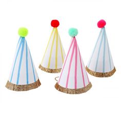 three party hats with pom poms on them