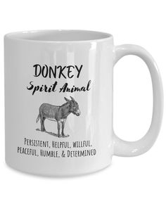 a white coffee mug with an image of a donkey and the words donkey spirit animal