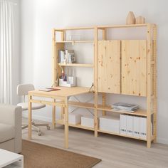 a room with a desk, bookshelf and chair