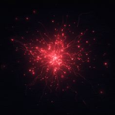 red fireworks exploding in the dark sky at night