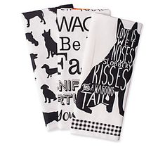 three napkins with black and white designs on them, one has a silhouette of a dog