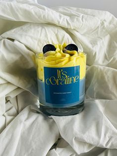 a candle that is sitting on a bed