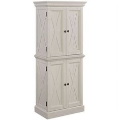 a tall white cabinet with two doors