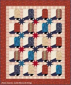 a quilt with red, white and blue stars on it's center is shown