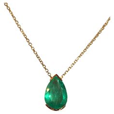 Natural Fine Colombian Emerald Pear Drop Pendant, crafted in an 18 Karat Gold bezel setting – designed to show the spectacular brilliance and beautiful medium green color and excellent transparency of this magnificent gemstone. - Natural Colombian Emerald 3.00 Carats. - Set in 18 Karat Gold. - Length 15.00mm Width 8.00 mm Depth 5.79 mm. - Suspended on 18 Karat Gold chain, 18 inches in length. Exquisite Pear-shaped Emerald Necklace For Formal Occasions, Luxury Pear-shaped Emerald Gemstone Necklace, Luxury Teardrop Emerald Necklace With 17 Jewels, Pear-shaped Emerald Gemstone Necklace For Formal Events, Pear-shaped Emerald Gemstone Necklace For Formal Occasions, Formal Pear-shaped Emerald Necklace In Fine Jewelry Style, Formal Pear-shaped Emerald Necklace Fine Jewelry, Formal Pear-shaped Emerald Necklace, Briolette Emerald Necklace For Formal Occasions