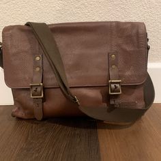 Selling A Gently Used Men’s Cole Haan Messenger Bag In Brown Genuine Leather With Beautiful Orange Lining On The Inside. This Bag Has Multiple Compartments With Zipper On The Inside And Adjustable Shoulder Strap. This Bad Is Super Classic, One Similar Selling At Saks For $800. Please Ask Questions Before Bidding. All Sales Are Final. All Items Come From A Smoke, Pet, And Drug Free Home Designer Tan Satchel For Travel, Designer Rectangular Briefcase With Adjustable Strap, Designer Tan Satchel With Adjustable Strap, Designer Brown Flap Bag For Travel, Designer Travel Tote Saddle Bag, Designer Rectangular Saddle Bag For Travel, Designer Saddle Tote Bag For Travel, Designer Tan Flap Bag For Everyday Use, Designer Flap Bags With Adjustable Strap