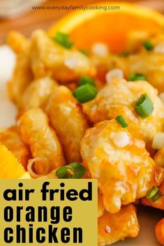 an orange chicken dish on a plate with the words air fried orange chicken