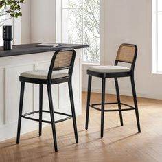 Elevated in height, Edith marries spill-resistant bouclé seats with an open-weave backrest. Serve up charm and dine in comfort.​ High Top Dining Table Kitchen, Cane Counter Stool, Black Counter Stools, Arctic Tern, Basement Furniture, Kursi Bar, Quartz Kitchen Countertops, Stools For Kitchen Island, Dine In