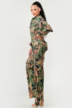 Blend in with style in our Camo Cutie Jumpsuit! This denim jumpsuit features ruffled long sleeves and cargo pockets for a unique twist on a classic style. Perfect for those sunny days when you want to stand out from the crowd. Button up front closure, great quality and comfort. Cocktail Dress Curvy, Camo Jumpsuit, Casual Cocktail Dress, Cocktail Dress Formal, Ruffle Long Sleeve, Spring Sweater, Jumpsuit With Sleeves, Effortless Elegance, Ruffle Sleeves