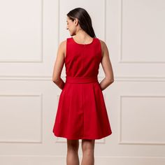 Strike a stunning silhouette in our sleeveless ponte skater dress. Cut from our substantial and soft organic cotton blend ponte knit, this dress has just the right mix of stretch and structure. Features a zipper at the side seam, pockets, and a removable waist sash for a customizable look. A dress for holiday and beyond. Stretch A-line Sleeveless Dress For Work, Chic A-line Sleeveless Cotton Dress, Fitted Belted Cotton Dresses, Belted Fitted Cotton Dresses, Fitted Cotton Belted Dress, Sleeveless Cotton Belted Dress, Red Fitted Sleeveless Cotton Dress, Fitted Red Sleeveless Cotton Dress, Knit Skater Dress