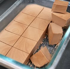 several blocks of chocolate in a glass dish