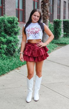 Fear the Spear! Show off your game day spirit with The Fear the Spear Cap Sleeve Crop. This cropped tee features a bold graffiti style graphic and cap sleeves for a modern take on fan gear. Perfect for pairing with your favorite skirt, get ready to cheer on the Seminoles in style! Details: *OFFICALLY LICENSED* Super Soft, & Stretchy Knit Tee 100% Cotton Crew Neckline, Cap Sleeve, Cropped Length Features Fear the Spear Graphic on Center Chest Color: White True to Size: Relaxed fit Julia is wearin Casual Summer Game Day Crop Top, Casual Summer Crop Top For Game Day, Summer Casual Cheerleading Crop Top, Casual Summer Crop Top For Cheerleading, Summer Casual Crop Top For Cheerleading, Tallahassee Florida, Fashion Bottoms, Florida State University, Florida State Seminoles