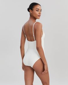 Chic and retro-inspired, The Veronica One-Piece is a luxe staple. This moderate coverage one-piece offers support with underwire cups and adjustable straps. Wear it to the beach or with your favorite pair of pants to double as a bodysuit. Fitted Cream Summer Swimwear, Elegant Fitted Cream Swimwear, Fitted Cream One-piece Swimwear, Chic V-neck Stretch Swimwear, White One-piece Swimwear With Lined Body, Solid & Striped, Pair Of Pants, Wear It, Retro Inspired