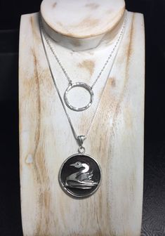 "Inspired by Once Upon a Time and Emma Swan, I created a replica cosplay Eternal necklace in sterling silver and I will then rhodium plate to keep from tarnishing. The eternal circle has zen meanings, the life circle, and is designed with this in mind. I've hammer textured the circle and attached the chain through the piece and soldered the jump rings for a permanent attachment. The circle ⭕️ pendant is fabricated from thick 12 gauge sterling silver and I hammer texture. The length is 15\" and m Life Circle, Inspired Necklace, Emma Swan, 12 Gauge, Circle Necklace, Circle Pendant, Jump Rings, Once Upon A Time, Rhodium Plated