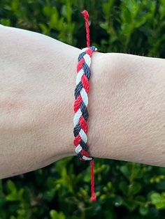 This bracelet stack duo is handmade by me from Brazilian waxed cord with an adjustable back. Bracelet can adjust from 5.5 inches to 8.5 inches in length.  Cleveland Guardians Themed 💙❤️🤍 Like the stack, but not the colors? This can be customized to any 3 colors of your choosing. Just let me know! Casual Red Braided Bracelets, Casual Red Resizable Friendship Bracelets, Casual Red Braided Waxed Cord Bracelets, Casual Red Resizable Braided Bracelets, Casual Red Braided Bracelet, Casual Red Friendship Bracelets With Adjustable Cord, Braided Bracelets, Bracelet Stack, Cleveland