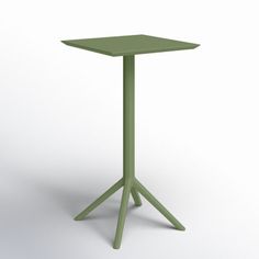 a small green table sitting on top of a white floor