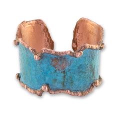 Sizing : 1.75 W x 7" L - Adjustable Material: Solid Copper Rustic Verdigris Patina Made from solid copper, this beautiful cuff boasts a beautiful verdigris patina with molten copper edging, giving it a rustic and luxurious appeal. The inside is designer signed, adding to the unique and high-end feel of this piece. Please note that it is slightly on the heavier side, making it sturdy and durable.To protect the beautiful patina and prevent oxidation, this cuff has been sealed with a triple baked l