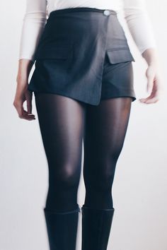 "Elevate your wardrobe with our unique creation - the Upcycled Chic Black Asymmetric Skort, skillfully crafted from a vintage blazer. Embrace sustainable fashion without compromising style in this one-of-a-kind, eco-friendly piece designed for the modern trendsetter. 🌟 Key Features: Vintage Blazer Transformation: This skort tells a story of reinvention, repurposed from a classic black blazer for a touch of nostalgia and uniqueness. Chic Asymmetry: Stand out with the avant-garde flair of an asym Fitted Bottoms With Asymmetrical Hem For Office, Fitted Party Shorts For Fall, Fitted Party Shorts, Fall Party Fitted Shorts, Fitted Asymmetrical Office Bottoms, Fitted Asymmetrical Bottoms For Office, Chic Fitted Bottoms For Layering, Chic Asymmetrical Fitted Shorts, Chic Fitted Asymmetrical Shorts