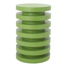 a stack of green plastic discs sitting on top of each other