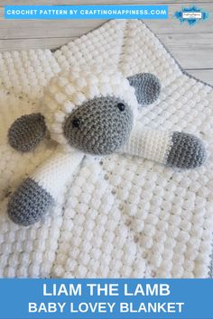 a crocheted lamb is laying on top of a blanket with the words i am the lamb baby lovey blanket