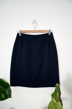 Stunning navy blue mini skirt in lovely condition.  Brand - Marella Labelled a UK10 but we would recommend to fit a UK8 Outer shell: 56% wool 34% viscose 10% nylon Lining is 64% acetate and 36% rayon Zips up at the back. Measurements (inches): Length - 19 Waist - 26 Hips - 35 Please note that returns are accepted however you will lose your delivery cost. Return costs are also the responsibility of the customer.  Please feel free to message with any questions! Thanks 😊 Fitted Wool Mini Skirt, Fitted Wool Skirt Short Length, Classic Fitted Wool Mini Skirt, Fitted Mini Skirt Suit With Lined Skirt, Fitted Wool Mini Skirt With Lining, Workwear Lined Skirt, Navy Blue Mini Skirt, Vintage Mini Skirt, Navy Pencil Skirt